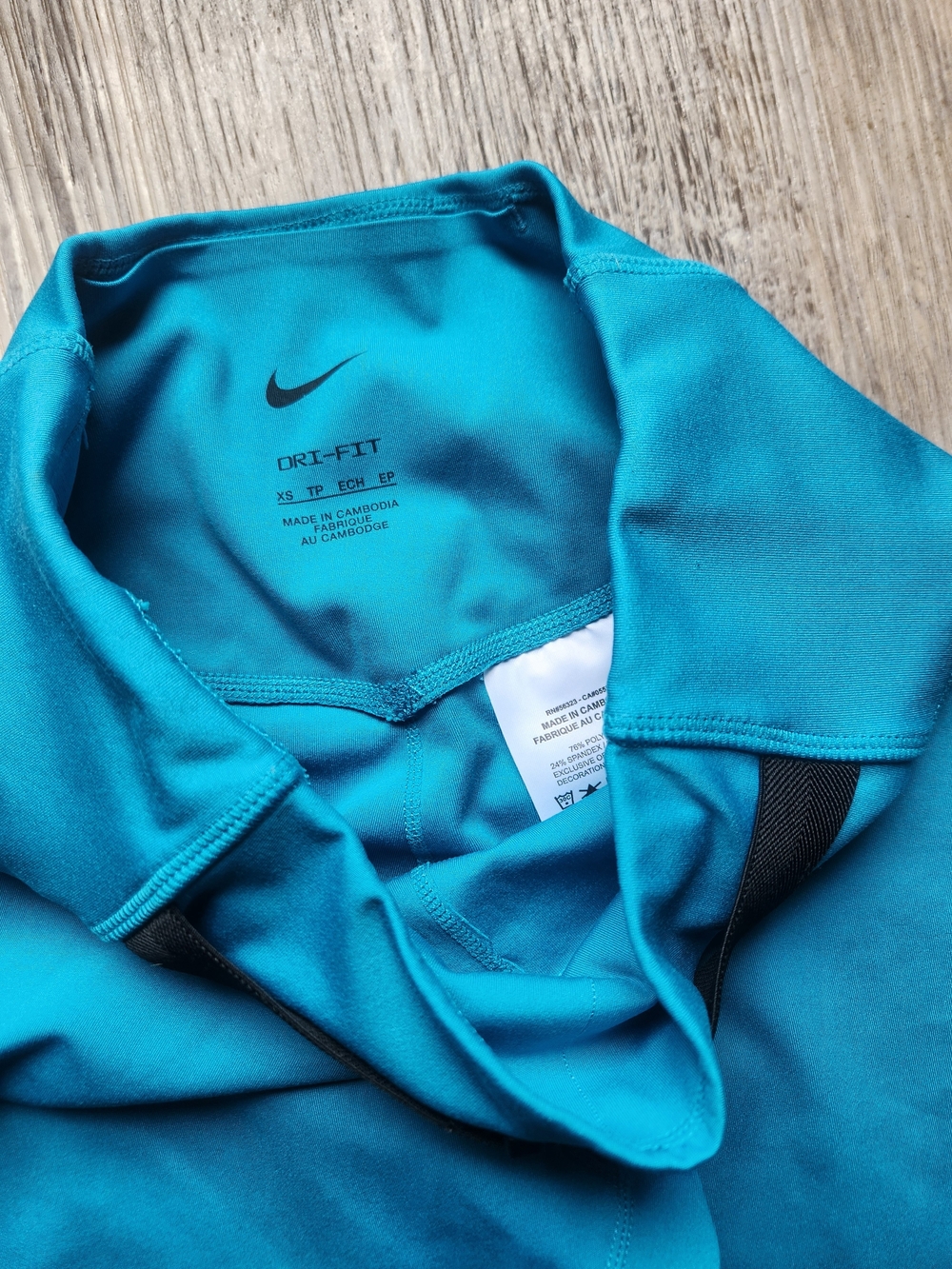 Nike Dri-FIT One Luxe Buckle Mid-Rise Leggings in a Cyber Teal color - Picture 6 of 6